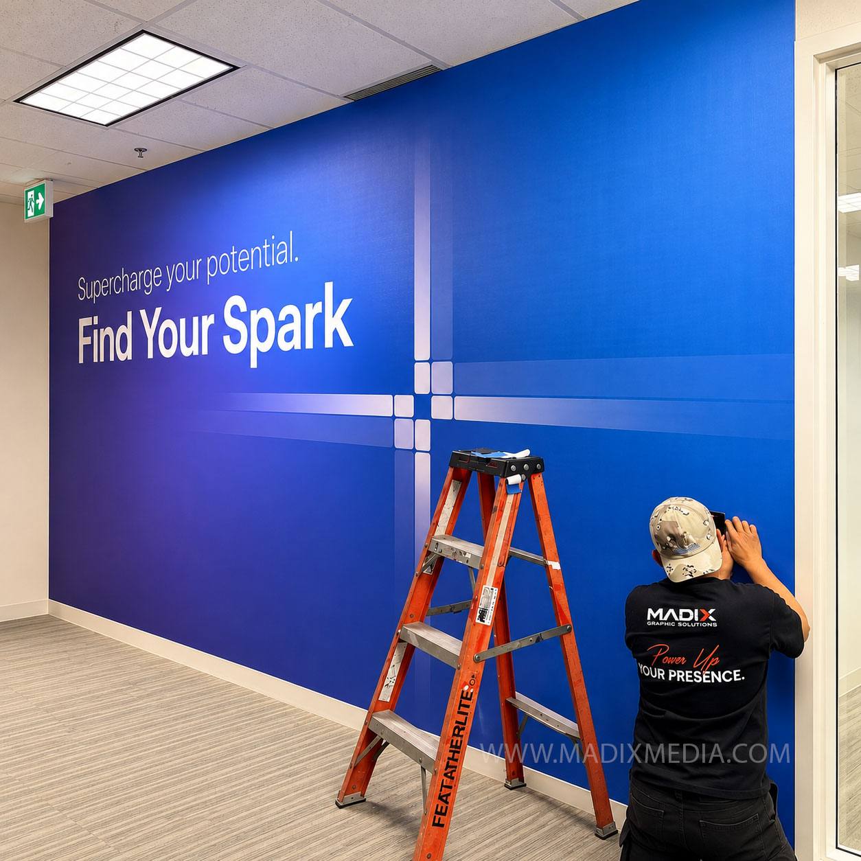 Madix installer applying a printed office wall mural