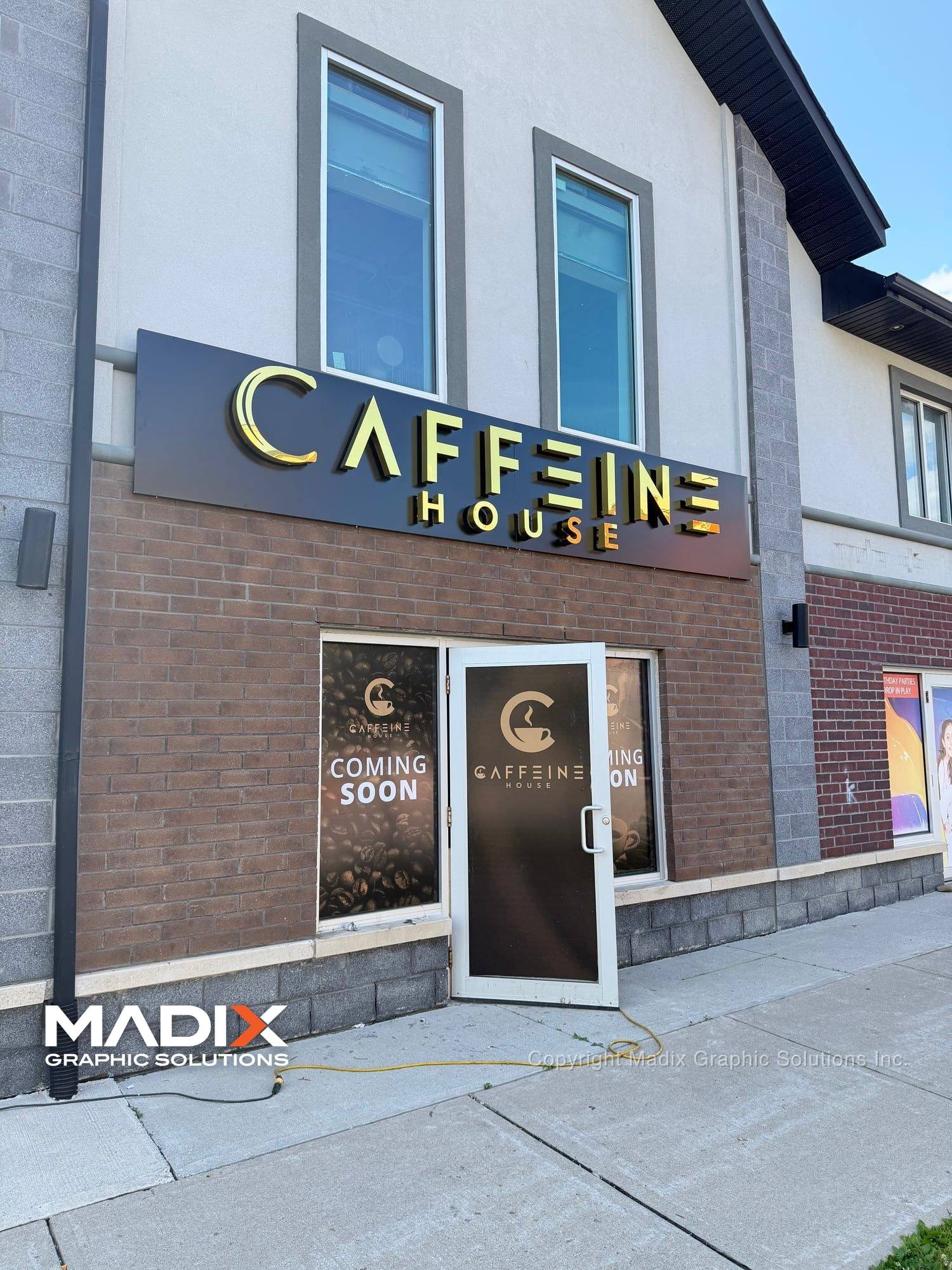 Gold dimensional letter sign on a coffee shop